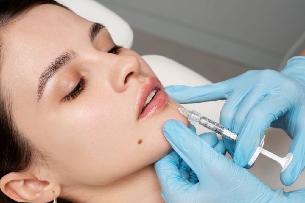 close up woman getting lip filler treatment in gurgaon